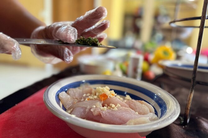 NEW! Authentic Bahamian Cooking and Cocktails with Transfers - Sitting down to eat what you prepared