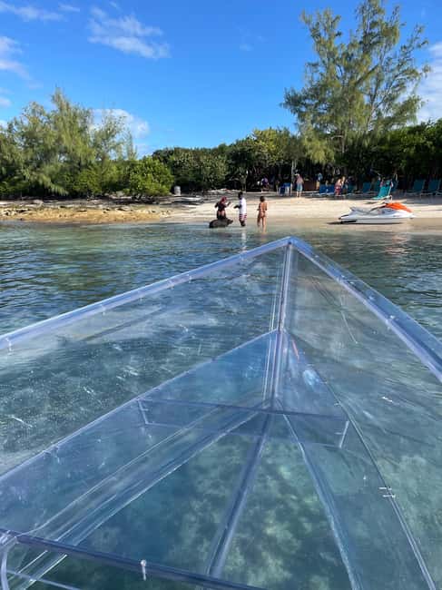 The Clear Boat Experience Bahamas drinks and snacks included - Looking through the clear boat near Nassau